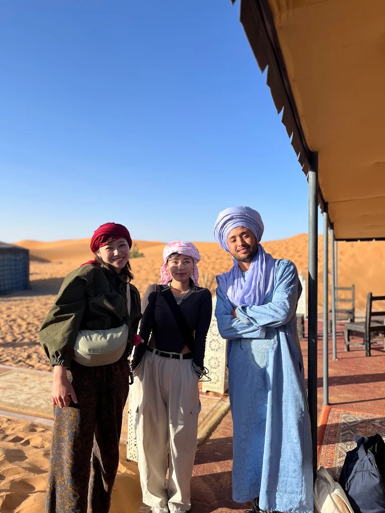 Aziz, local Merzouga host, welcoming travelers in the Sahara